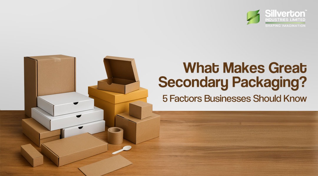 Assorted cardboard boxes on a wooden surface with text 'What Makes Great Secondary Packaging? 5 Factors Businesses Should Know' and Silverton Industries logo.